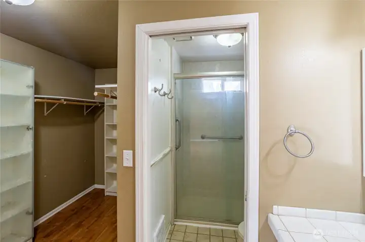 Primary bedroom has large walk-in closet off private bathroom.