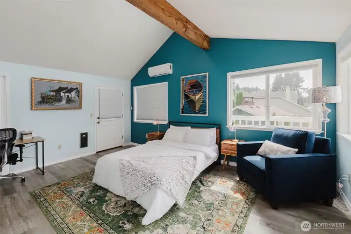 Primary Bedroom has two access doors to front and back wrap around deck