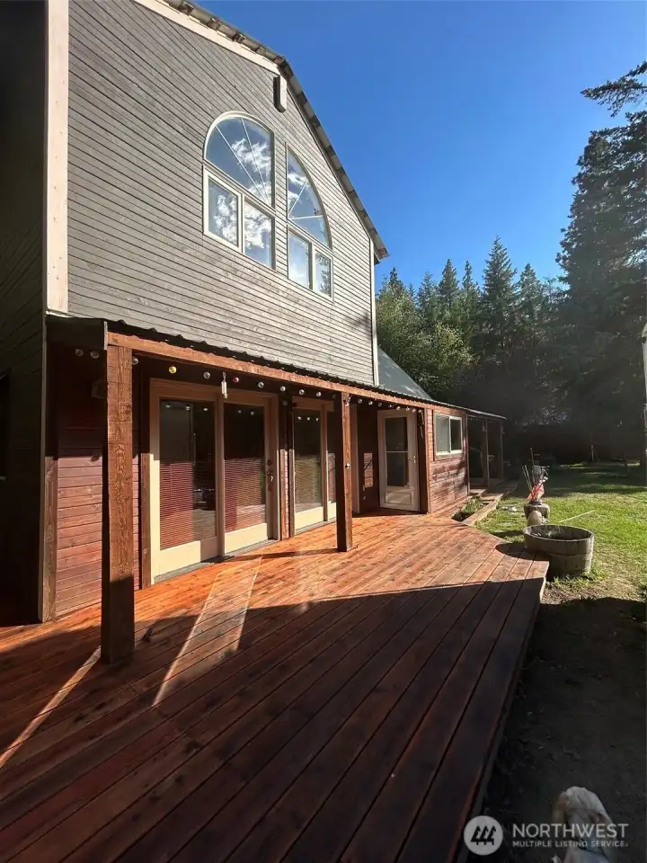Front of home with large wrap around deck