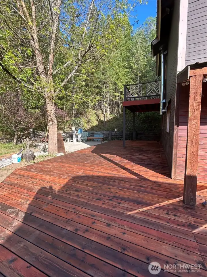 wrap around deck and  primary balcony