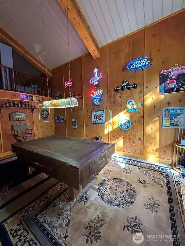 Pool table and neon wall