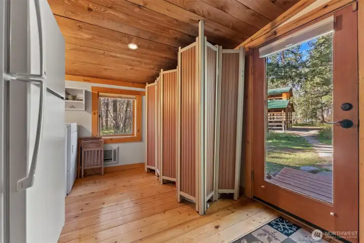The entry and mudroom houses the fridge, washer and dryer and water heater.