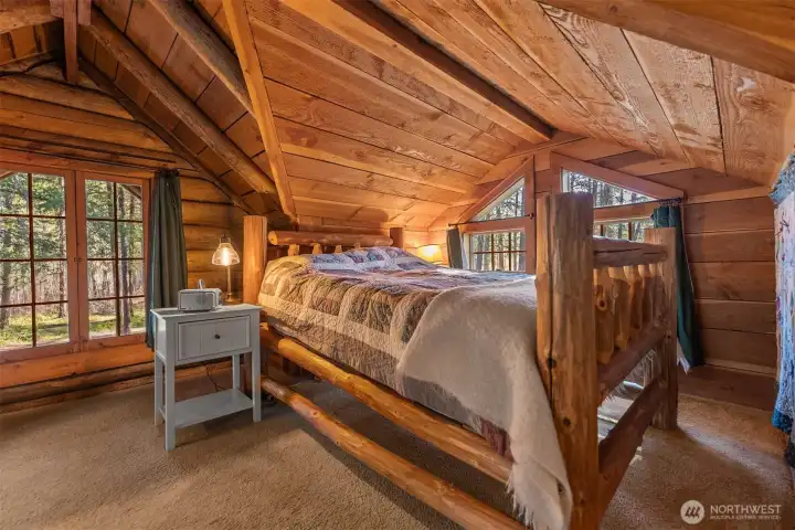 The queen-sized log bedframe can stay with the sale.
