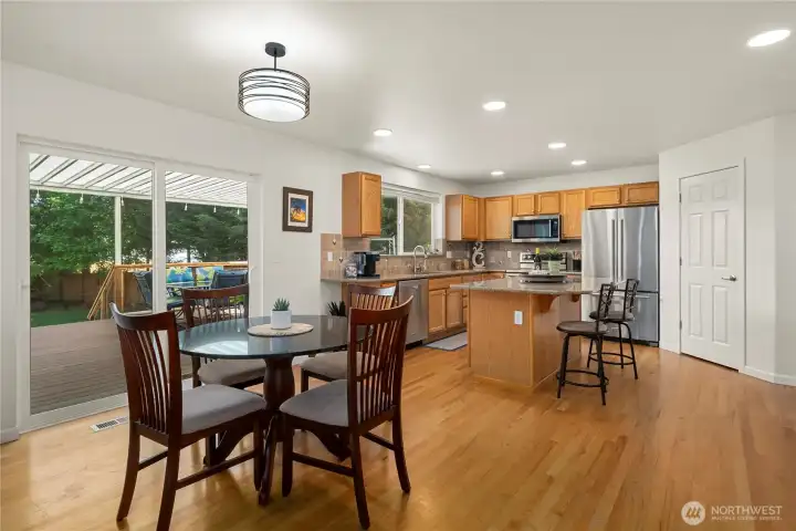 Large kitchen with plenty of cabinets, counters, island, pantry and newer Kitchen Aid appliances.