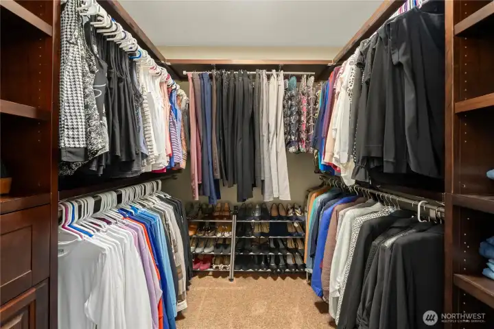 Walk-in closet one with custom built ins.