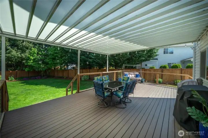 This deck is fantastic for relaxing and entertaining.  Work from home on your covered deck and enjoy this beautiful yard.