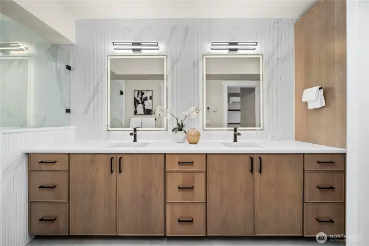 Double vanity with linen closet and laundry pullout