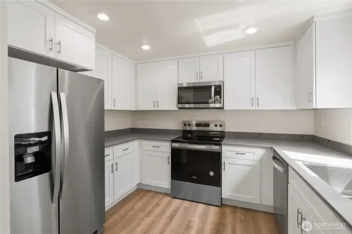 Unit B kitchen with all new appliances. Unit B kitchen with all new appliances.