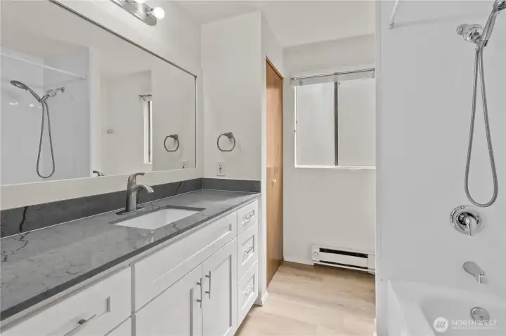 Unit B remodeled bathroom with quartz counters and shaker style cabinets Unit B remodeled bathroom with quartz counters and shaker style cabinets