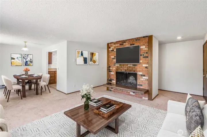Unit C living room with stylish brick fireplace adds elevated charm to these units. Virtually staged. Unit C living room with stylish brick fireplace adds elevated charm to these units. Virtually staged.