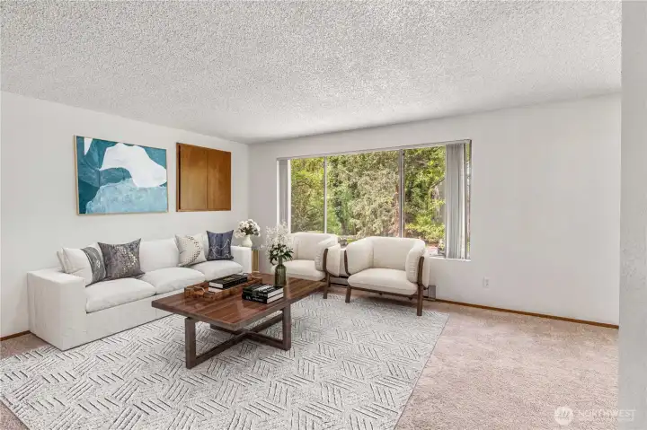 Unit C living room with peaceful view of greenery. Nice privacy at this building with open space behind the building. Just 4 units on this peaceful property. Virtually staged. Unit C living room with peaceful view of greenery. Nice privacy at this building with open space behind the building. Just 4 units on this peaceful property. Virtually staged.