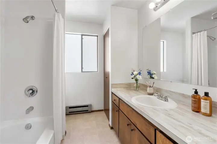 Unit C bathroom, very clean with newer tub surround. Virtually staged. Unit C bathroom, very clean with newer tub surround. Virtually staged.