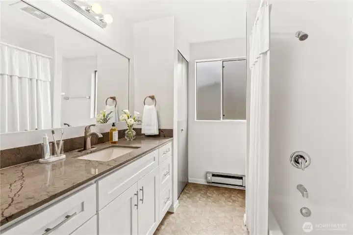 Unit D remodeled bathroom. Virtually staged. Unit D remodeled bathroom. Virtually staged.