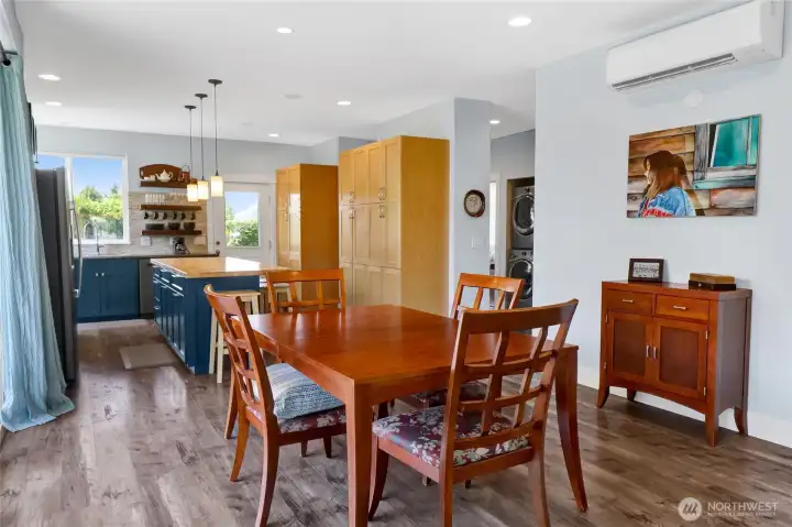 The dining area is conveniently located just off the kitchen and can easily accommodate a larger table, making it perfect for hosting family dinners and holiday gatherings.