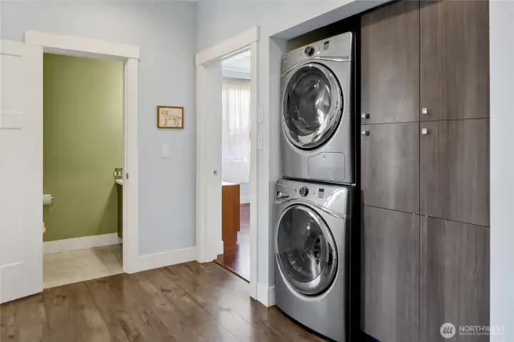 Powder room and laundry are thoughtfully located between the kitchen and the primary suite, offering everyday convenience and an efficient layout.