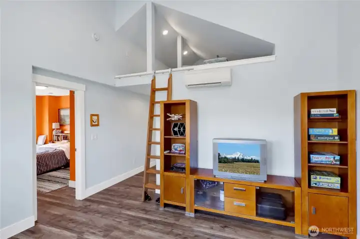 The loft adds character and versatility with its rolling library ladder, offering endless possibilities for storage, a play space, reading retreat, or the ultimate hide-and-seek spot.