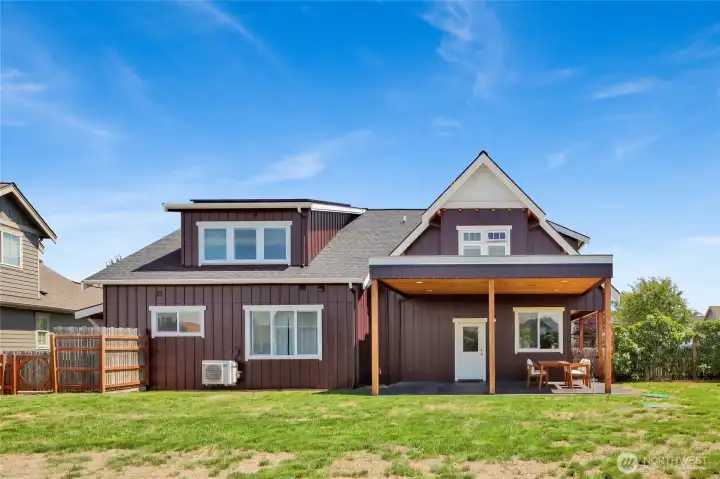 The covered patio extends your outdoor living space and features a thoughtfully designed roof structure ready to support a future rooftop garden — an opportunity to bring even more greenery and creativity to the property.