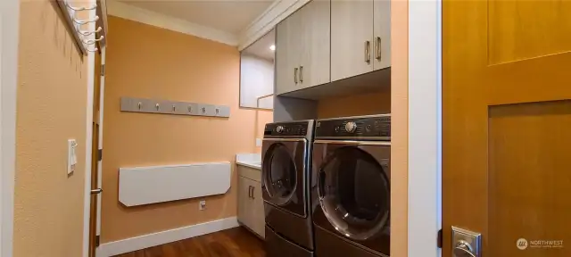 Laundry room with fold down table