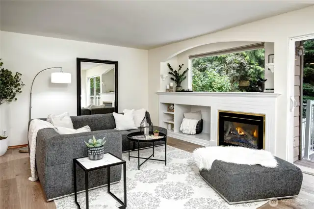 Snuggle in by the family room fireplace- enjoy backyard birds and private views.