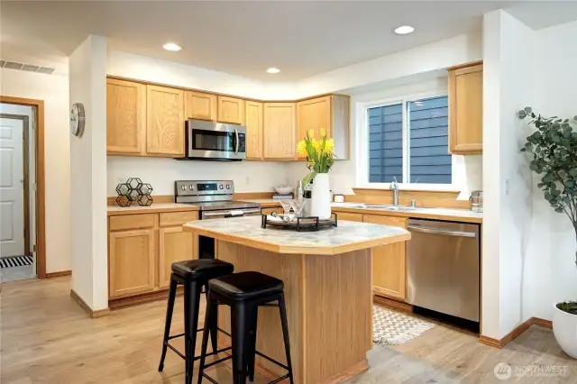 Sleek, stainless steel appliances and ample cupboard storage