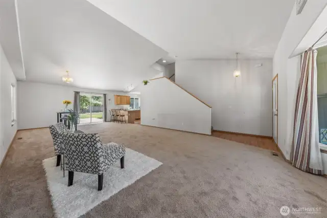 Stairwell overlooks kitchen and living/dining rooms
