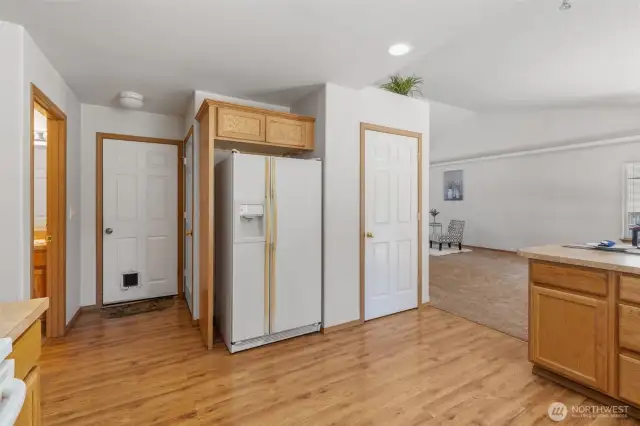 Kitchen pantry and 2nd closet off garage (door straight ahead)