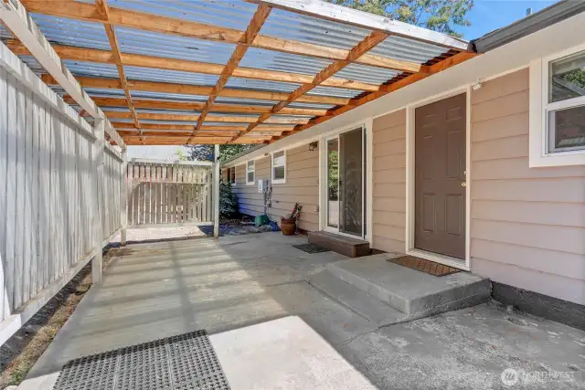 Step outside to your private covered patio—perfect for grilling, morning coffee, or relaxing in the shade. Fully fenced and tucked along the side of the home for added privacy.