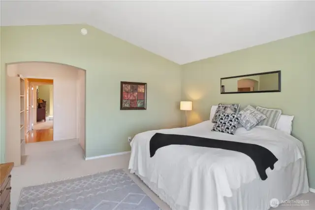 A serene Primary Bedroom with large connected Bathroom.