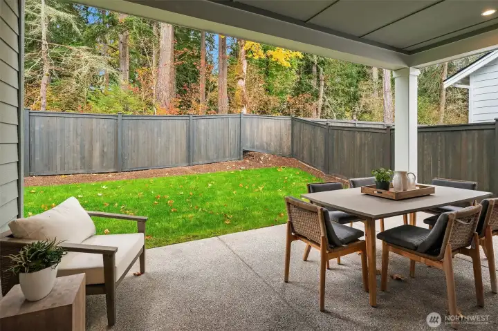 Spacious covered patio and fenced in yard