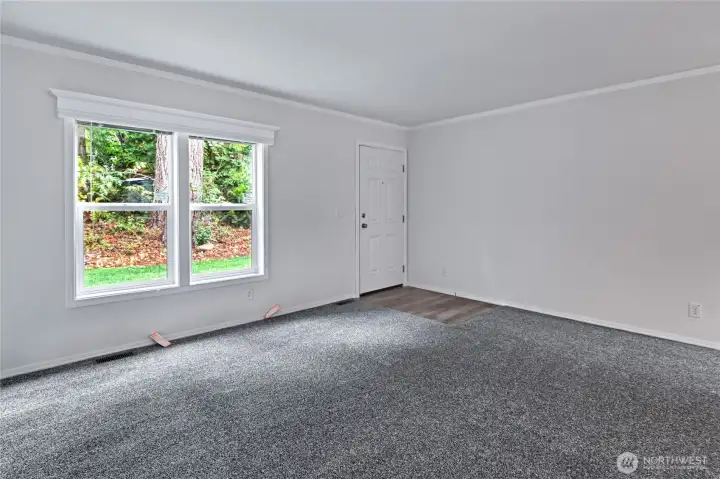 Oversized open living room welcomes you in.