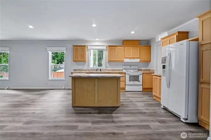 Chefs kitchen with breakfast bar.
