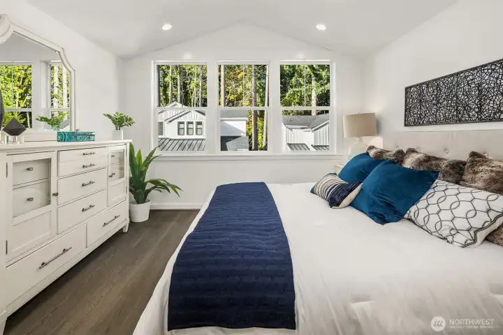 Secluded on the second floor, elegant vaulted ceilings complement the stunning primary bedroom suite