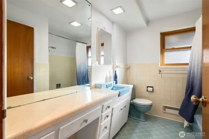 Main floor full bathroom with original charm