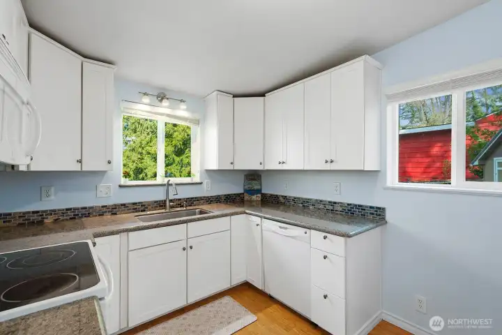 Kitchen with view, open to living/dining spaces,newer appliances and stacking washer/drier