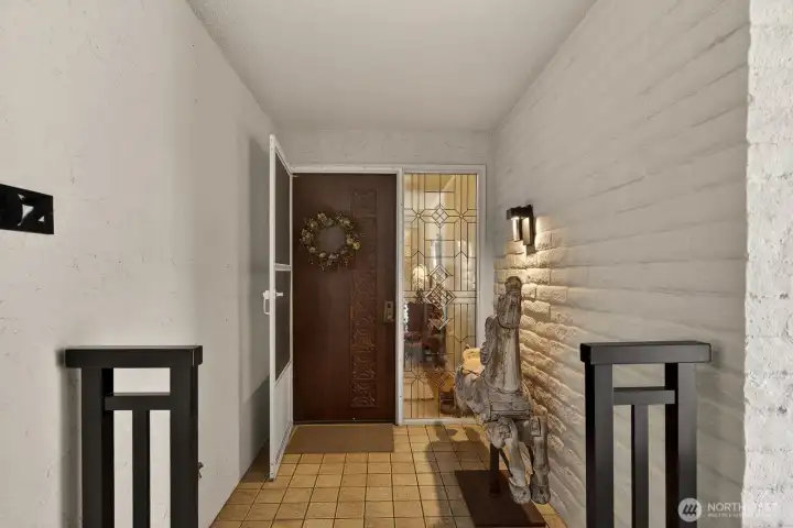 Welcoming covered entry. Short distance from elevator.