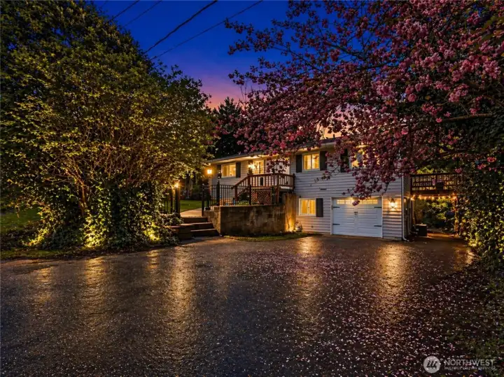 Front of home with lots of parking. Partially fenced.