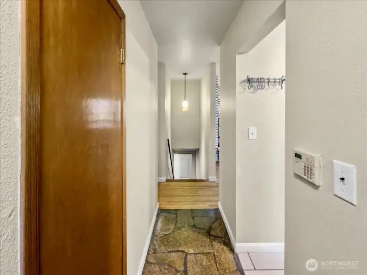 Entrance on the main level with stone flooring.