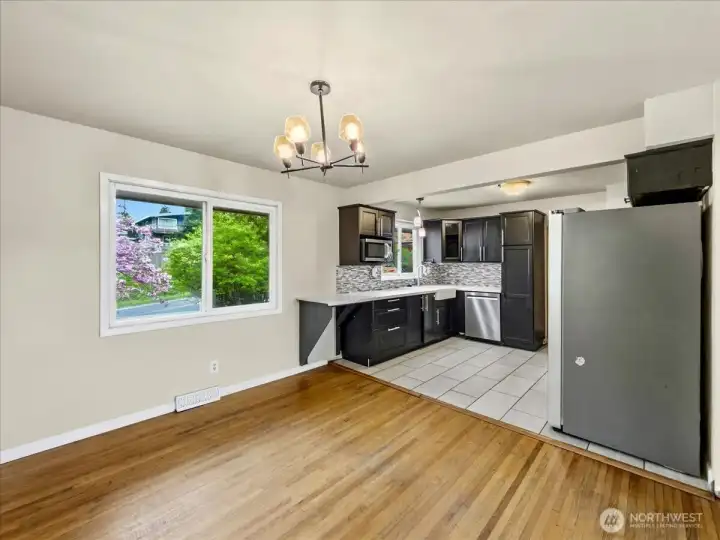 Updated kitchen with quartz counters, tile backsplash and stainless steel appliances. Separate dining area off the kitchen.