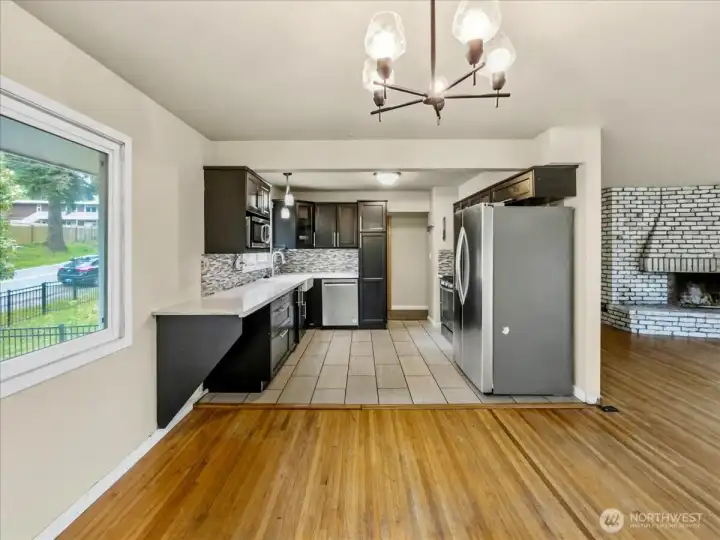 Updated kitchen with quartz counters, tile backsplash and stainless steel appliances. Separate dining area off the kitchen.
