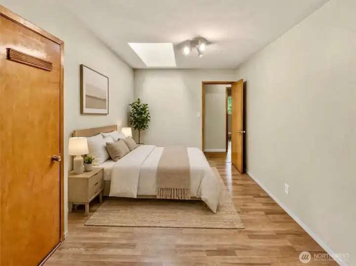 Private bedroom wing (or guest wing/other), featuring two bedrooms, each with their own ceiling fan; a storage closet; and direct access to the upper wrap-around deck [virtually staged]