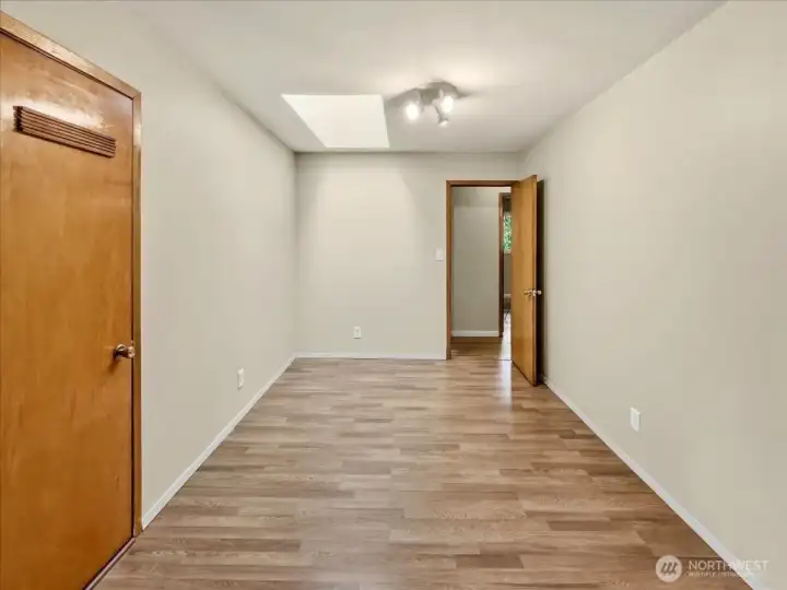 Private bedroom wing (or guest wing), featuring two bedrooms, each with their own ceiling fan; a storage closet; and direct access to the upper wrap-around deck.