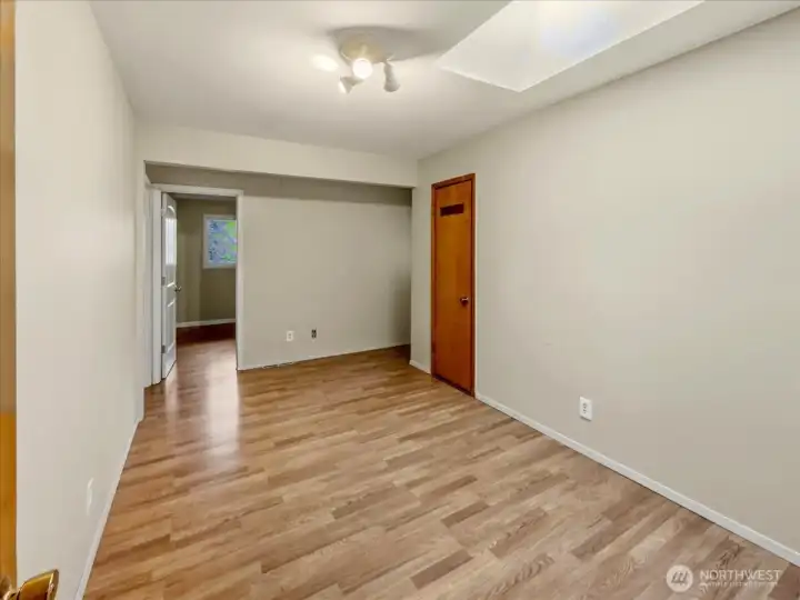 Private bedroom wing (or guest wing), featuring two bedrooms, each with their own ceiling fan; a storage closet; and direct access to the upper wrap-around deck.