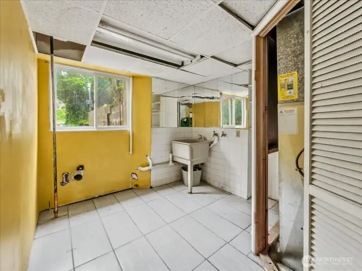 Large separate laundry room with utility sink shares space with your utility closet.