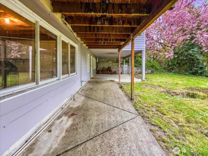 This secluded backyard is perfect for entertaining . The upper level offers a wrap around deck while the the ground level features a large covered patio that opens directly onto the spacious lawn.