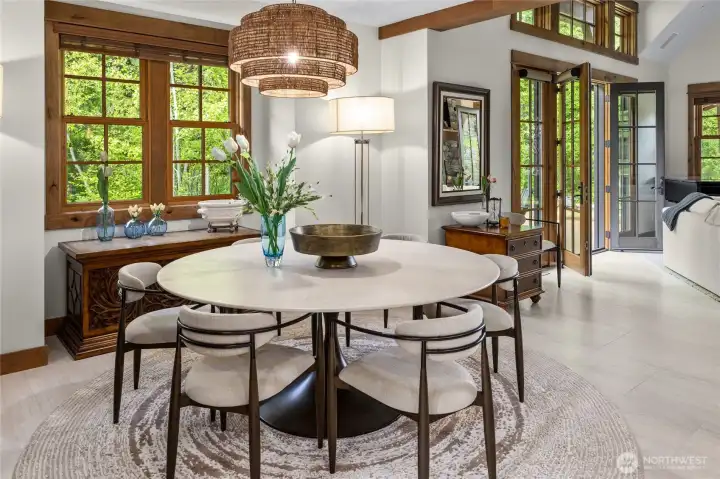 The dining area welcomes every occasion, from casual meals to formal dinners, all open to the great room and kitchen.