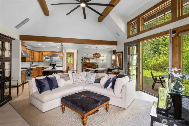 From the wood beam vaulted ceilings to two sets of french doors opening to the porch, every detail of the great room is designed for comfort and connection.