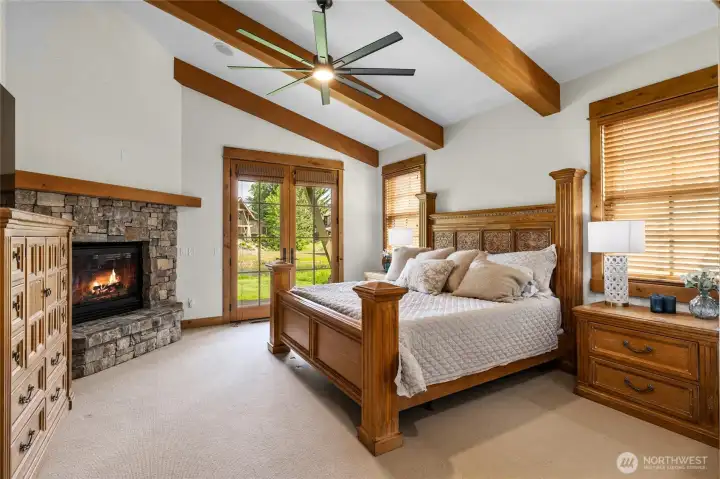 The expansive primary suite on the main level offers privacy, ease and private porch access.