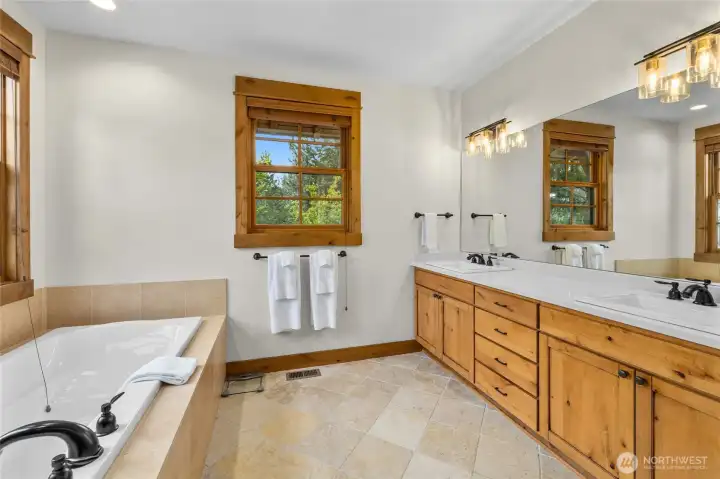 New countertops, sinks, lighting and new self cleaning toilet in the primary ensuite.