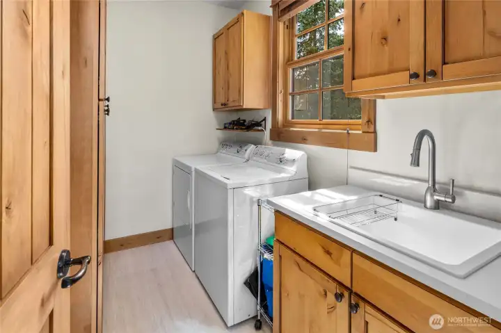 New laundry countertops, sink and faucets and new tankless hot water heater.