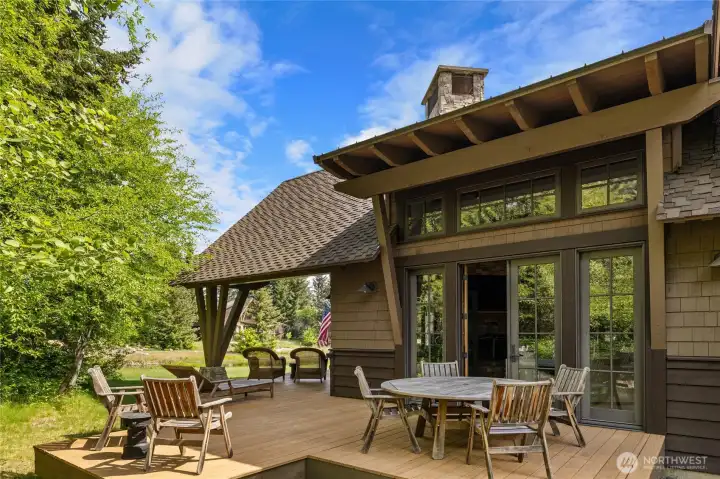 The wrap-around porch and covered outdoor living area with fireplace were designed for true four-season  enjoyment.
